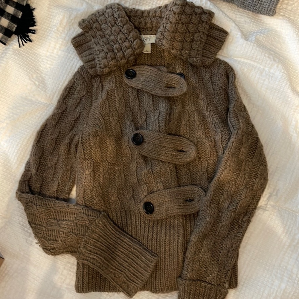 Warm! Brown sweater. Love the woven detail.
